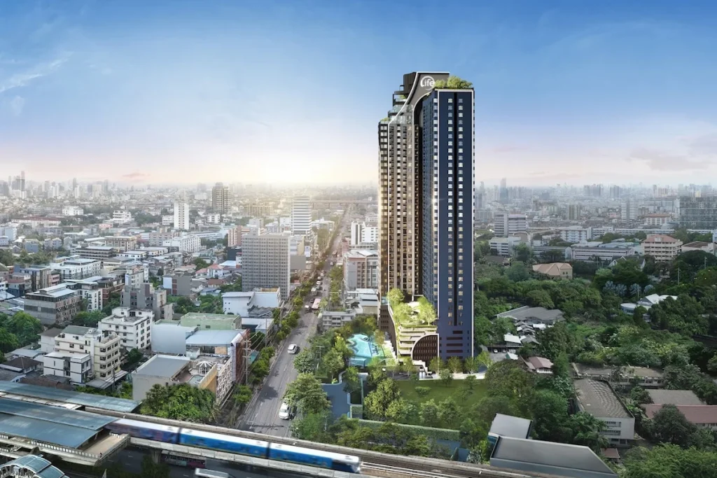 3D render of Life Udomsuk Station, a high-rise condominium near BTS Udom Suk in Bangkok, designed for modern urban living with full facilities.